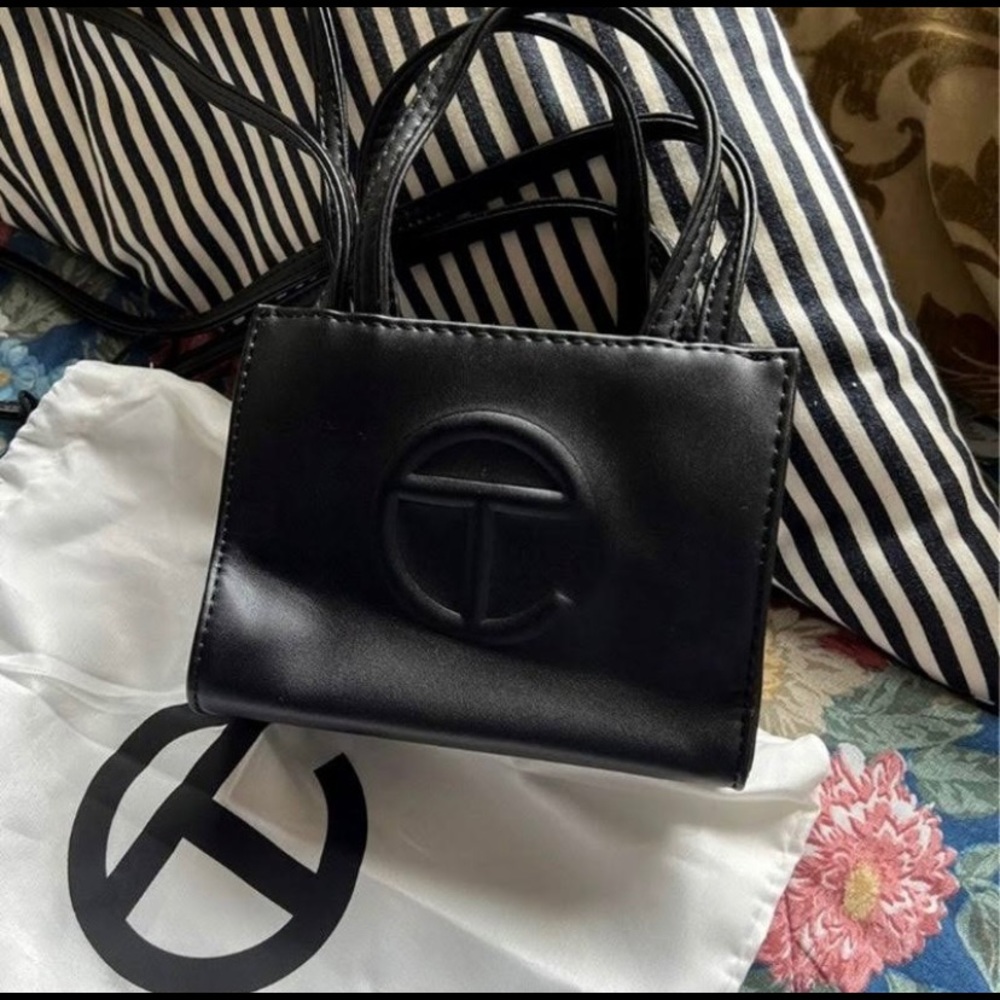 Black small Teflar bag. Worn once perfect condition.